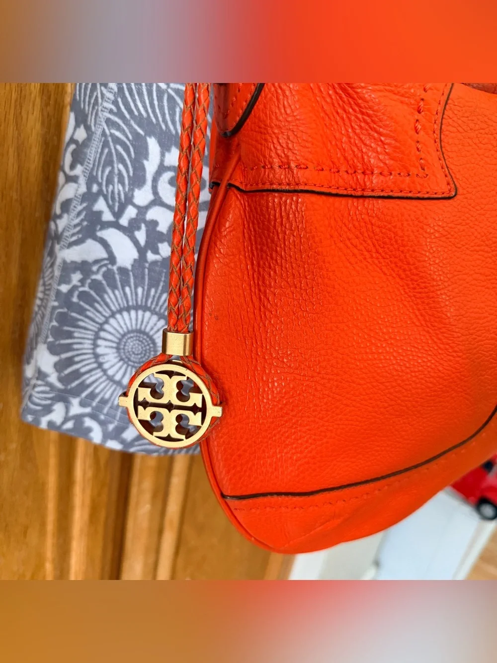 Tory Burch Amalie Adjustable-Strap Hobo features soft leather and signature gold